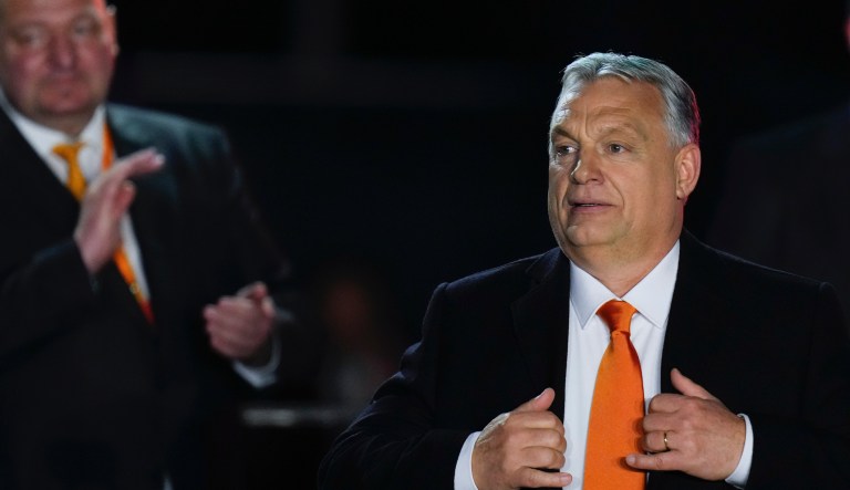 Hungary's Prime Minister Viktor Orban acknowledges cheering supporters during an election night rally in Budapest, Hungary, Sunday, April 3, 2022.