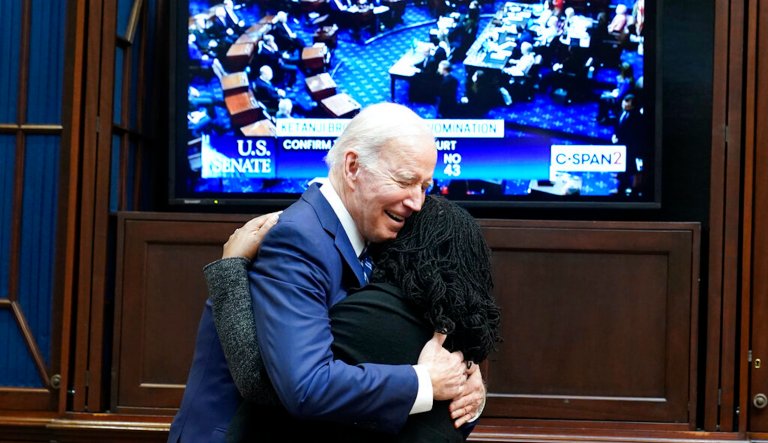 President Joe Biden hugs Supreme Court nominee Judge Ketanji Brown Jackson as they watch the Senate vote on her confirmation from the Roosevelt Room of the White House in Washington on Thursday.