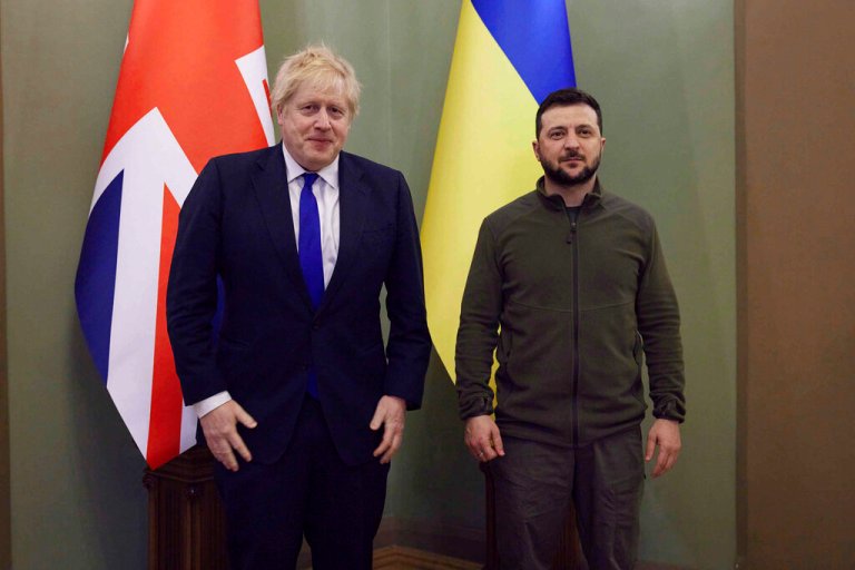 In this image provided by the Ukrainian Presidential Press Office, Britain's Prime Minister Boris Johnson, left, and Ukrainian President Volodymyr Zelensky pose for a photo in Kyiv, Ukraine, Saturday.