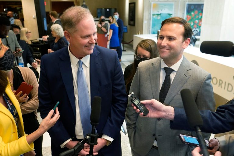 Senate President Wilton Simpson, left, and Speaker of the House Chris Sprowls smile as they speak with members of the media after the end of a legislative session, April 30, 2021, at the Capitol in Tallahassee, Fla.  