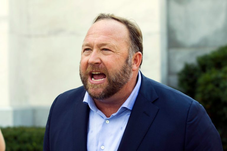 Infowars host and conspiracy theorist Alex Jones speaks outside of the Dirksen building on Capitol Hill, in Washington, Sept. 5, 2018. Jones will be getting back the $75,000 in fines he paid to a Connecticut court for failing to appear at a deposition last month in a lawsuit over his assertions that the Sandy Hook Elementary School shooting was a hoax, a judge has ruled, Thursday, April 14, 2022.                                                                                                                                                    