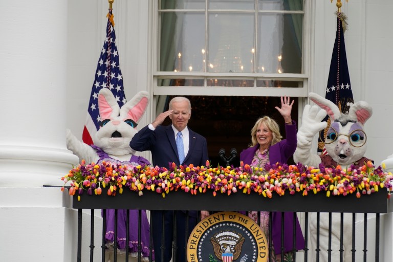 President Joe Biden appears and salutes with first lady Jill Biden and the Easter Bunnies.