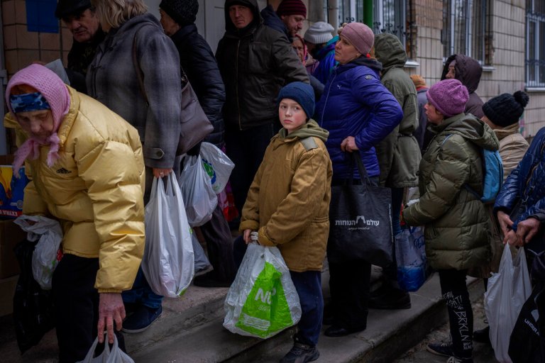 Sergei, 11, waits his turn to receive donated food during an aid humanitarian distribution in Bucha, in the outskirts of Kyiv, on Tuesday, April 19, 2022. Citizens of Bucha are still without electricity, water and gas after more than 44 days since the Russian invasion began.