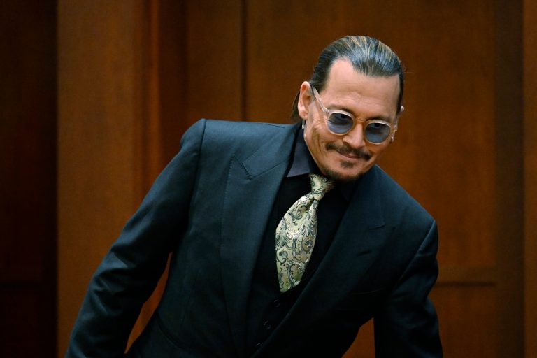 Actor Johnny Depp returns from a break during a hearing at the Fairfax County Circuit Court in Fairfax, Virginia, Tuesday April 19, 2022.