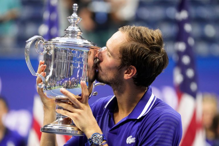 Daniil Medvedev, of Russia, kisses the championship trophy after defeating Novak Djokovic, of Serbia, in the men's singles final of the U.S. Open tennis championships, Sunday, Sept. 12, 2021, in New York. Tennis players from Russia and Belarus will not be allowed to play at Wimbledon this year because of the war in Ukraine, the All England Club announced Wednesday, April 20, 2022.