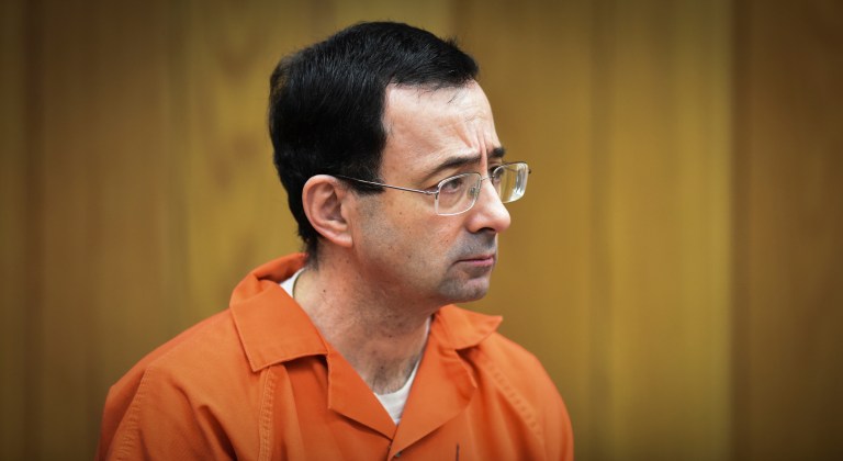 In this Feb. 5, 2018 file photo, Larry Nassar, former sports doctor who admitted molesting some of the nation's top gymnasts, appears in Eaton County Court in Charlotte, Mich. Thirteen sexual assault victims of Nassar are seeking $10 million each from the FBI, claiming a bungled investigation by agents led to more abuse by the sports doctor, lawyers said Thursday, April 21, 2022. 