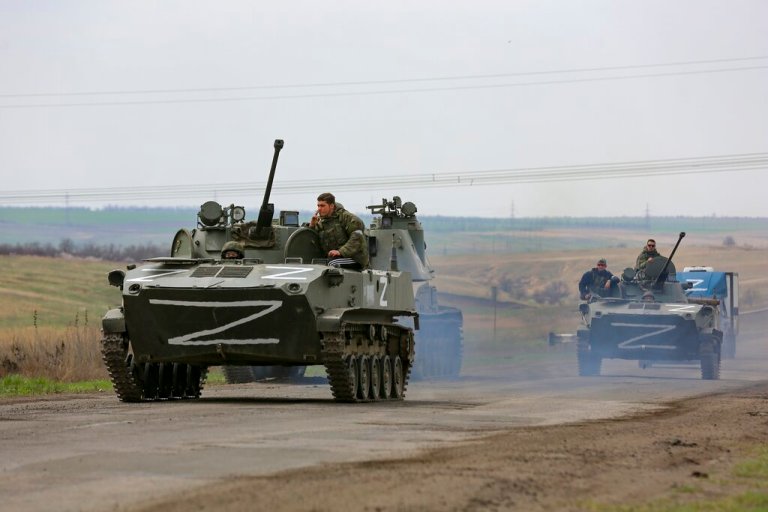 Russian military vehicles move on a highway in an area controlled by Russian-backed separatist forces near Mariupol, Ukraine, Monday, April 18, 2022. 