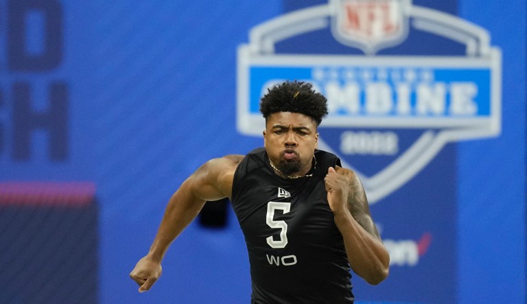Arkansas wide receiver Treylon Burks runs the 40-yard dash at the NFL football scouting combine, Thursday, March 3, 2022, in Indianapolis.