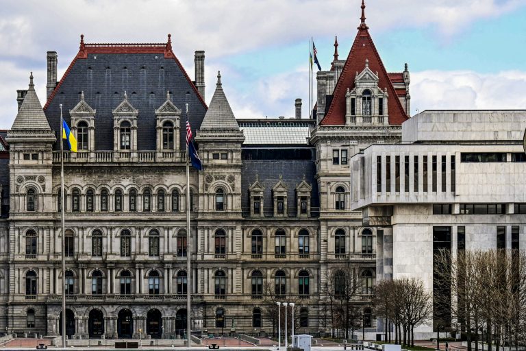 A partial view of the New York state Capitol building, left, is shown next to the state Appellate court building in foreground, right, Monday, April 4, 2022, in Albany, New York.