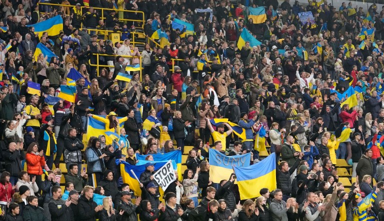 Ukraine supporters celebrate after a charity soccer match between Bundesliga team Borussia Dortmund and Dynamo Kyiv of Ukraine in the Signal Iduna Park in Dortmund, Germany, Tuesday, April 26, 2022. The match wants to show solidarity with Ukraine against Russia's war in favour of peace in Europe, the net proceeds of the match will be donated to charity. 