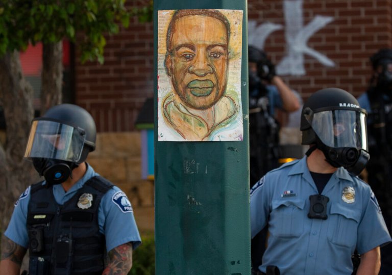 FILE - Minneapolis police stand outside the department's 3rd Precinct on May 27, 2020, in Minneapolis. Almost two years after George Floyd died at the hands of four Minneapolis police officers, Minnesota's Department of Human Rights released findings from an investigation into whether the city police department had a pattern or practice of racial discrimination in policing. (Carlos Gonzalez/Star Tribune via AP)