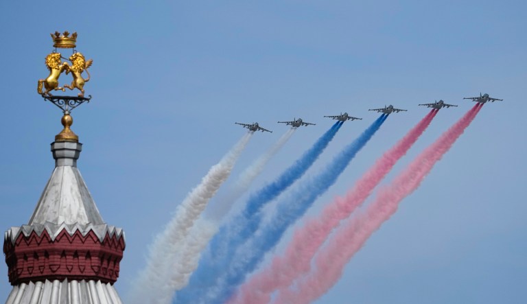 Russian warplanes fly over Red Square leaving trails of smoke in colours of the national flag during a dress rehearsal for the Victory Day military parade in Moscow, Russia, Saturday, May 7, 2022.