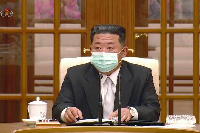 In this image made from video broadcasted by North Korea's KRT, North Korean leader Kim Jong Un wears a face mask on state television during a meeting acknowledging the country's first case of COVID-19 Thursday, May 12, 2022, in Pyongyang, North Korea.