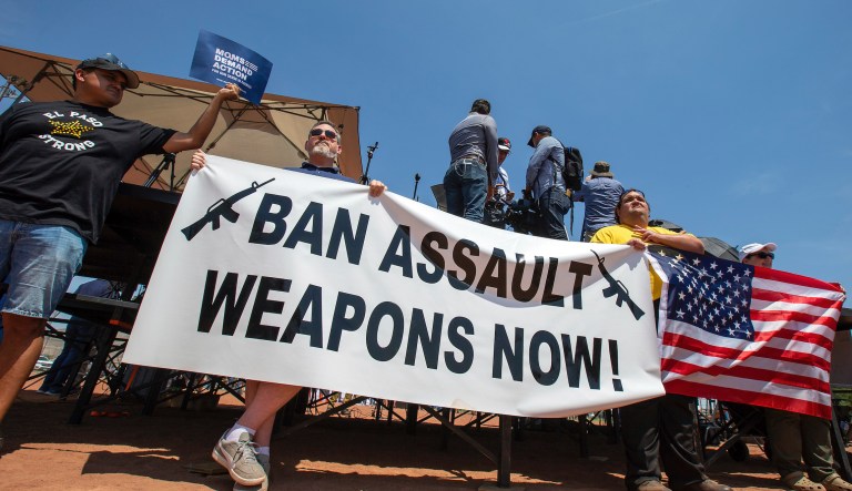 Demonstrators hold a banner to protest the visit of President Donald Trump to the border city after the Aug. 3 mass shooting in El Paso, Texas, on Aug. 7, 2019. A gunman killing multiple elementary school children and adults in Texas on Tuesday, May 24, 2022, adds to the state's grim recent history of mass shootings.