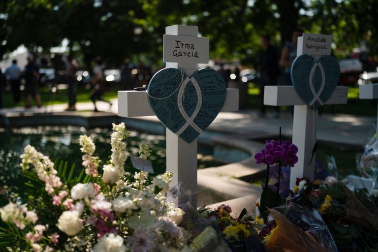 Messages are written on a cross honoring Irma Garcia, a teacher who was killed in this week's elementary school shooting, in Uvalde, Texas, Thursday, May 26, 2022. 