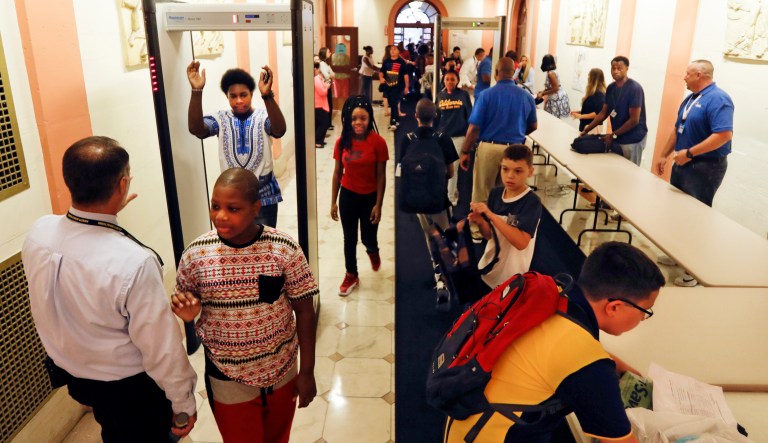 Students at William Hackett Middle School pass through metal detectors on the first day of school, on Sept. 6, 2016, in Albany, N.Y. 