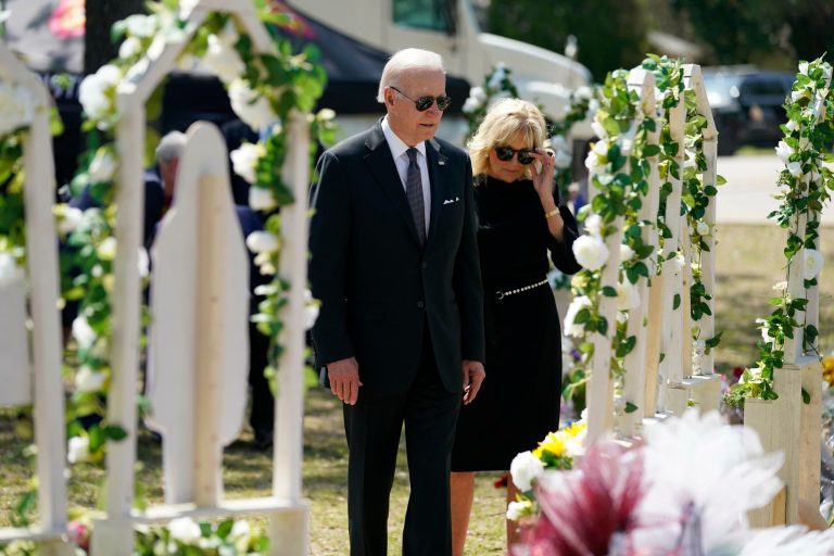 President Joe Biden and first lady Jill Biden visit a memorial at Robb Elementary School to pay their respects to the victims of the mass shooting, Sunday, May 29, 2022, in Uvalde, Texas. 