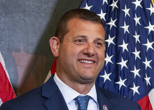 House Speaker Nancy Pelosi of Calif., administers the House oath to Rep. Connie Conway, D-Calif., during a mock swearing in ceremony at the Capitol in Washington, Tuesday, June 14, 2022, as Rep. David Valadao, R-Calif., holds the Bible. 