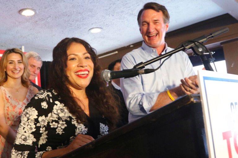 Winner of Tuesday's Republican primary for the 7th district congressional race, Yesli Vega, left, speaks to the crows along with Virginia Gov. Glenn Youngkin at a restaurant Wednesday, June 22, 2022, in Woodbridge, Va. 
