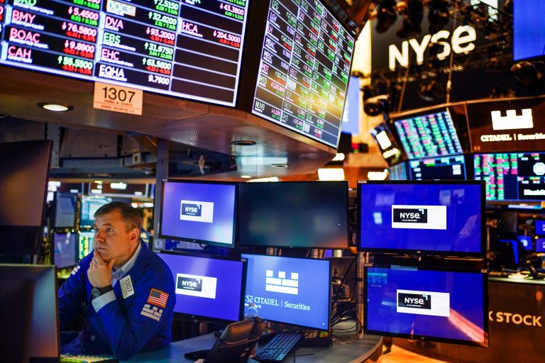 A trader works on the floor at the New York Stock Exchange in New York.