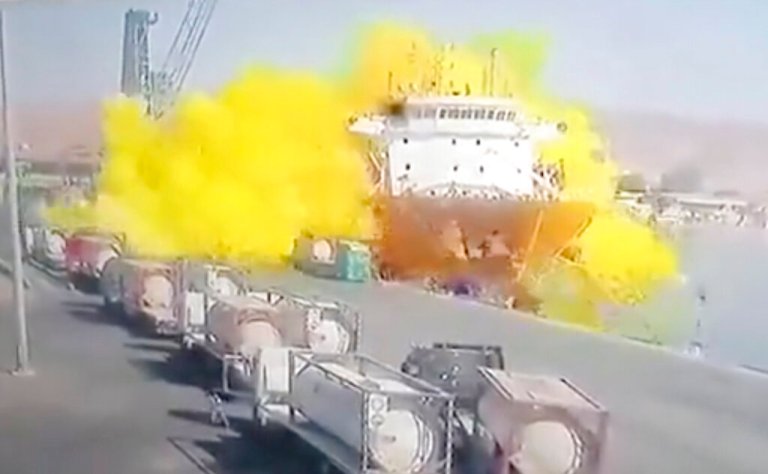 This photo taken from CCTV video broadcasted by Al-Mamlaka TV shows a chlorine gas explosion after it fell off a crane in the port of Aqaba, Jordan, Monday, June 27, 2022. Some dozen workers were killed and scores were hospitalized.