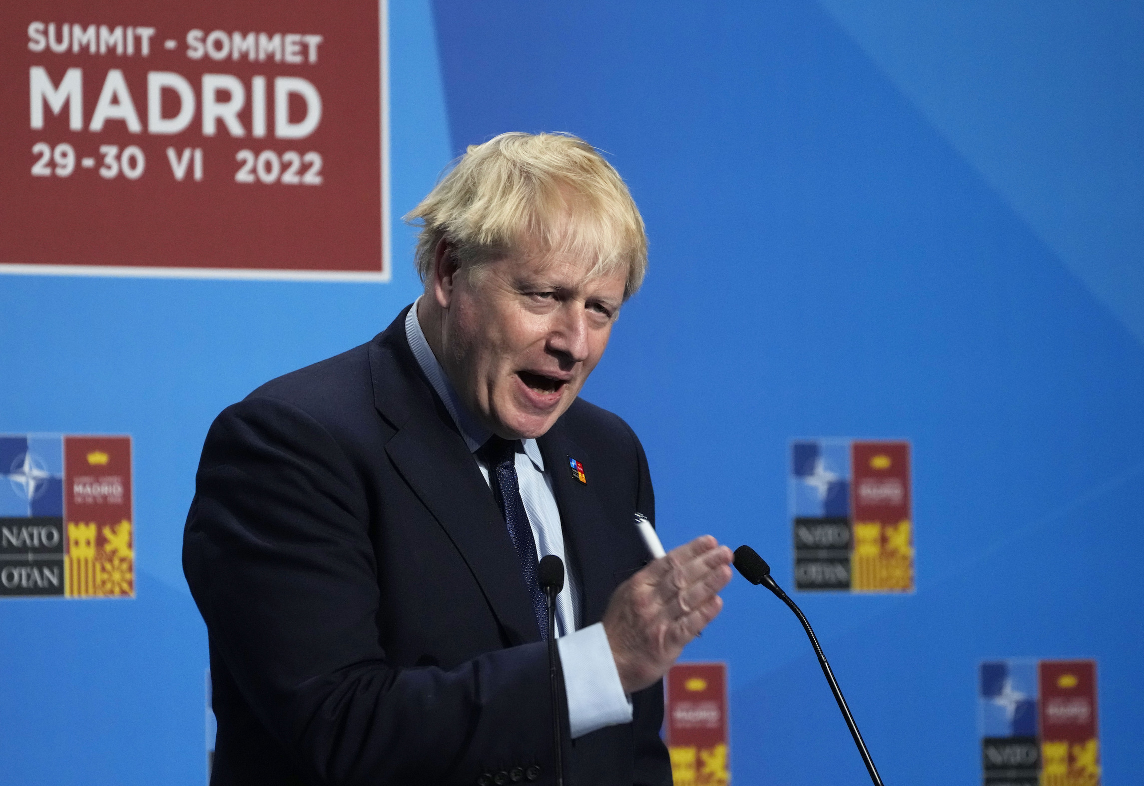 Boris Johnson fights for survival as top ministers resign
