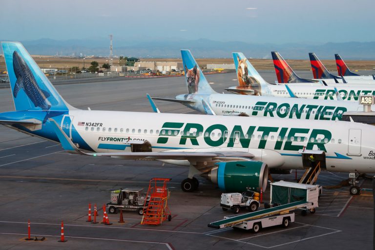 FILE - In this Sept. 22, 2019, file photo, Frontier Airlines airliners stand at gates at Denver International Airport in Denver, Colo. Frontier announced July 11 it will not raise its bid in its war with JetBlue Airways to takeover Spirit Airlines. (AP Photo/David Zalubowski, File)