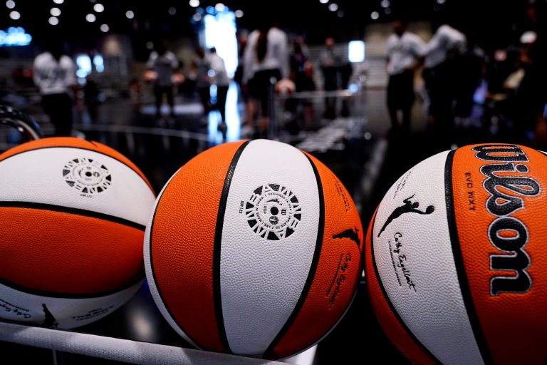 Basketballs sit in a rack during practice for the WNBA All-Star basketball game in Chicago, Saturday, July 9, 2022. Iowa basketball commit Ava Jones's father, William 