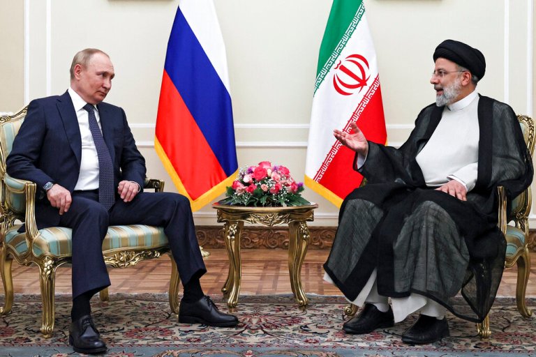 Russian President Vladimir Putin, left, listens to Iranian President Ebrahim Raisi during their talks at the Saadabad palace, in Tehran, Iran, Iran, Tuesday, July 19, 2022.