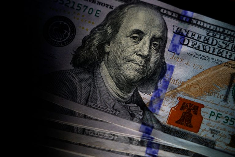 The likeness of Benjamin Franklin is seen on U.S. $100 bills, Thursday, July 14, 2022, in Marple Township, Pennsylvania. Alaskan residents will receive a direct one-time payment of up to $3,284 in only two days. (AP Photo/Matt Slocum)