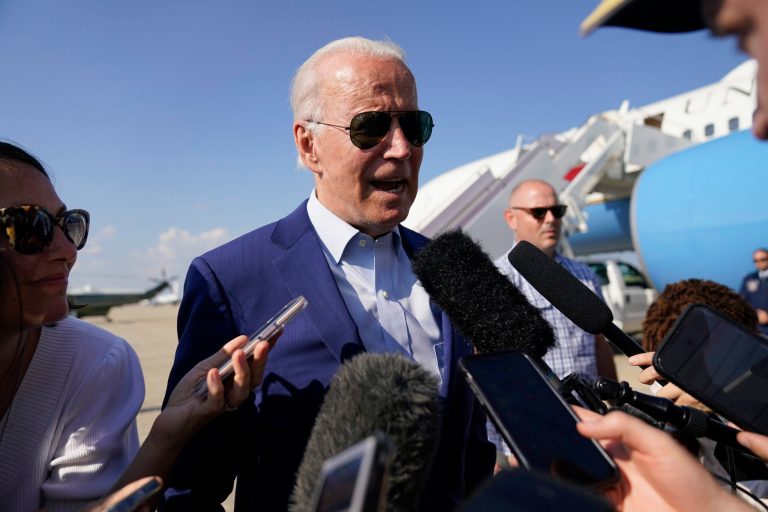 President Joe Biden speaks to members of the media after exiting Air Force One, Wednesday, July 20, 2022, at Andrews Air Force Base, Md. Biden is returning from a trip to Somerset, Mass., where he spoke about climate change. Biden has tested positive for COVID-19, the White House announced Thursday. (AP Photo/Evan Vucci)