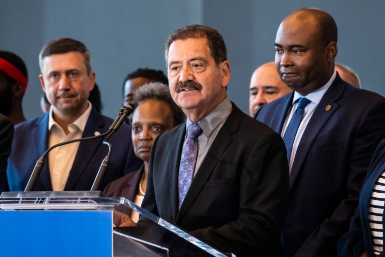 Flanked by other elected officials and representatives from the Democratic National Committee, Rep. Jesus 