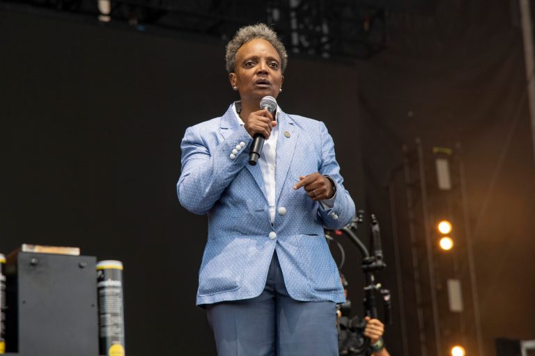 Chicago Mayor Lori Lightfoot speaks on day one of the Lollapalooza Music Festival on Thursday, July 28, 2022, at Grant Park in Chicago. Lightfoot appointed a seven-member interim police oversight commission on Monday that is charged with taking the first step toward delivering civilian oversight of the Chicago Police Department. (Photo by Amy Harris/Invision/AP)