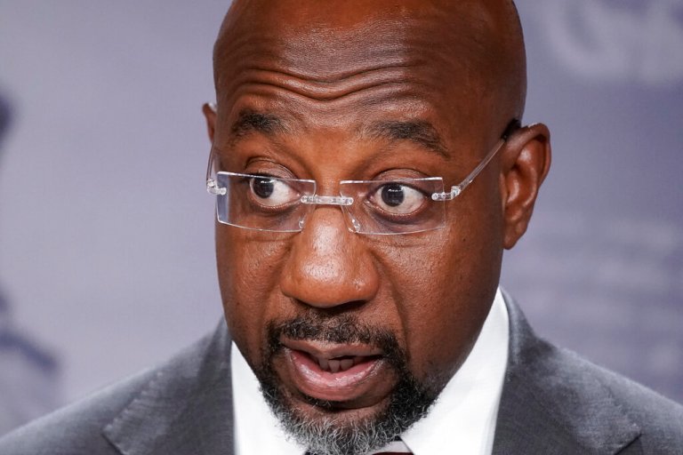 Sen. Raphael Warnock (D-GA) speaks to reporters.