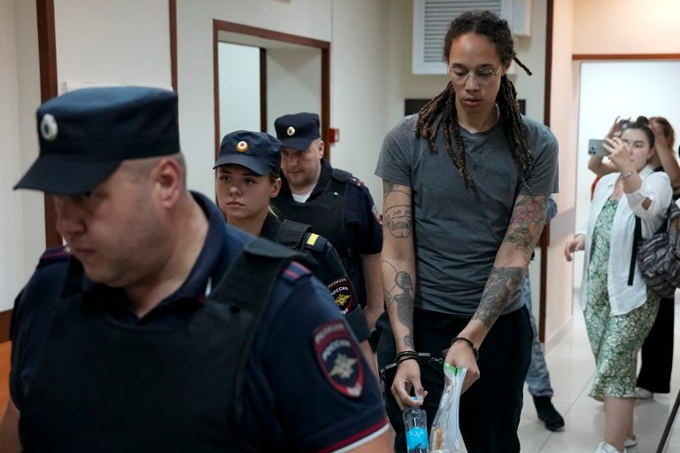WNBA star and two-time Olympic gold medalist Brittney Griner is escorted from a court room after her last words, in Khimki just outside Moscow, Russia, Thursday, Aug. 4, 2022. 