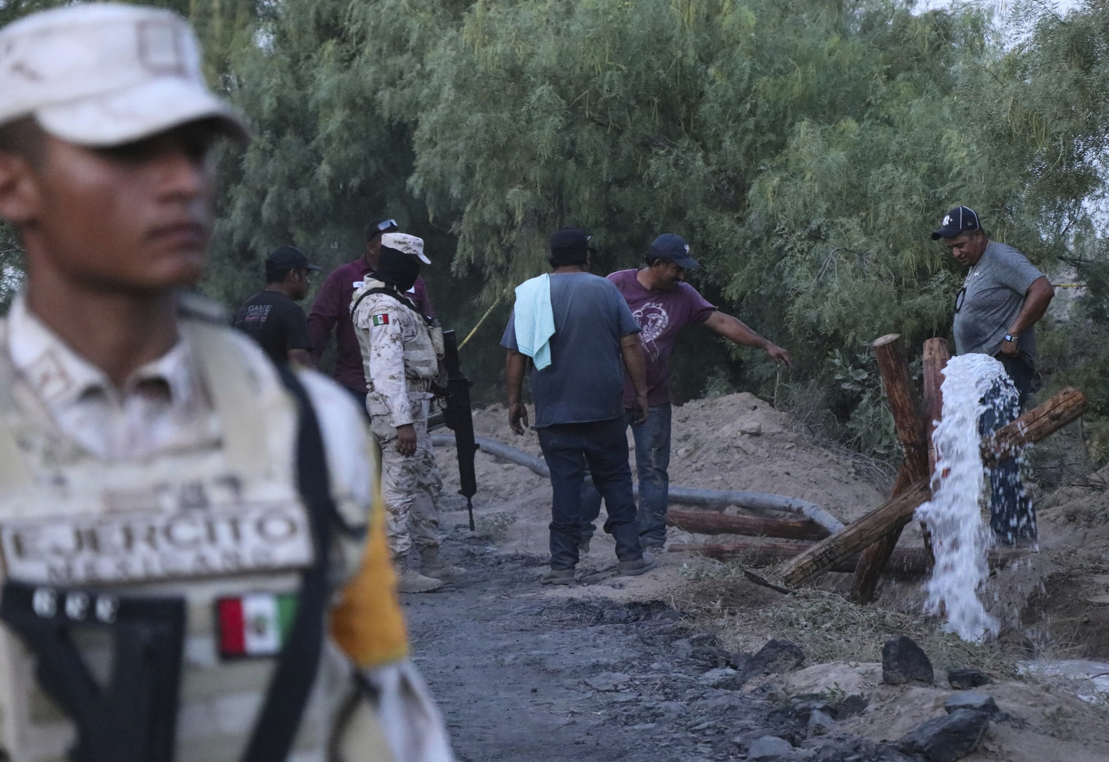 Rescue divers blocked by debris in effort to rescue miners trapped for eight days