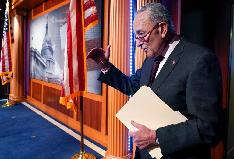 Senate Majority Leader Chuck Schumer answers one final question before leaving after a news conference.