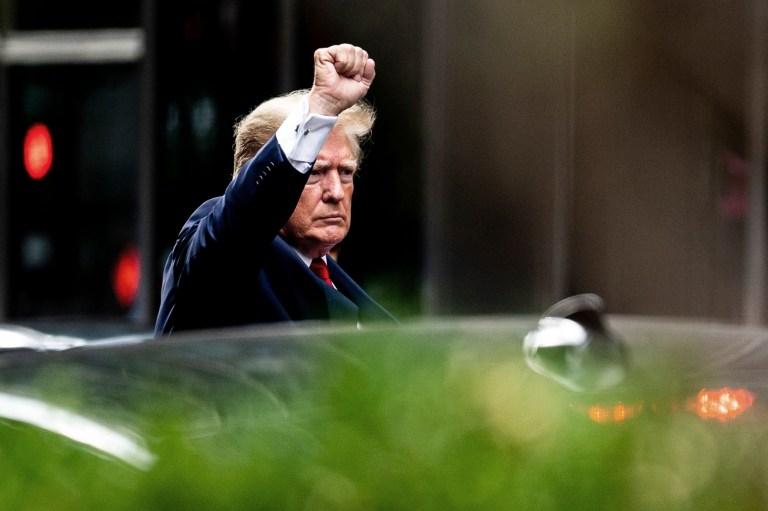 Former President Donald Trump gestures as he departs Trump Tower, Wednesday, Aug. 10, 2022, in New York, on his way to the New York attorney general's office for a deposition in a civil investigation.