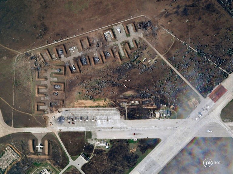 This satellite image provided by Planet Labs PBC shows destroyed Russian aircraft at Saki Air Base after an explosion Tuesday, Aug. 9, 2022.