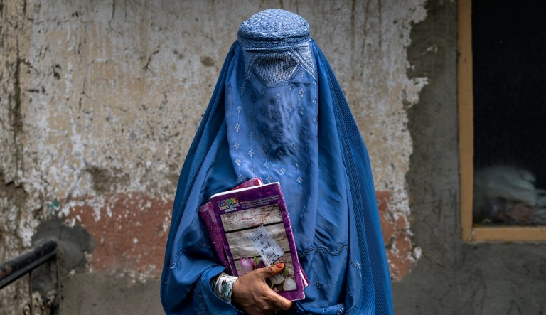 Arefeh 40-year-old, an Afghan woman leaves an underground school, in Kabul, Afghanistan, Saturday, July 30, 2022.