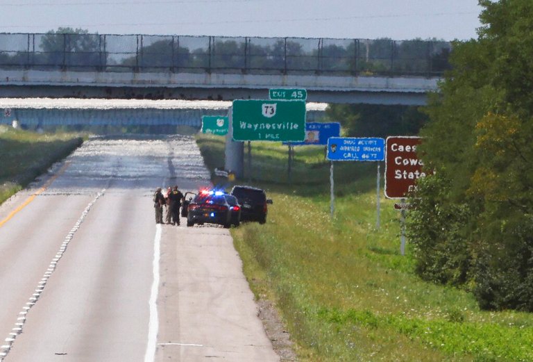 Waves of heat radiate off Interstate 71 in Clinton County near Cincinnati, which was closed during a standoff Thursday.