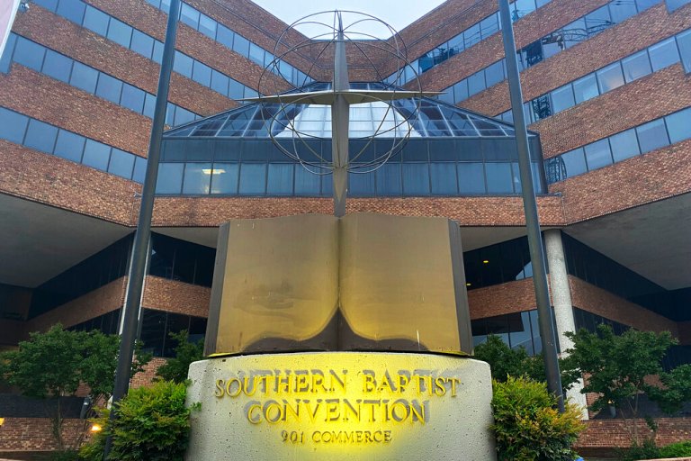 A cross and Bible sculpture stand outside the Southern Baptist Convention headquarters in Nashville, Tenn., on May 24, 2022. The Executive Committee of the Southern Baptist Convention said Friday, Aug. 12, 2022, that several of the denomination's major entities are under investigation by the U.S. Department of Justice.
