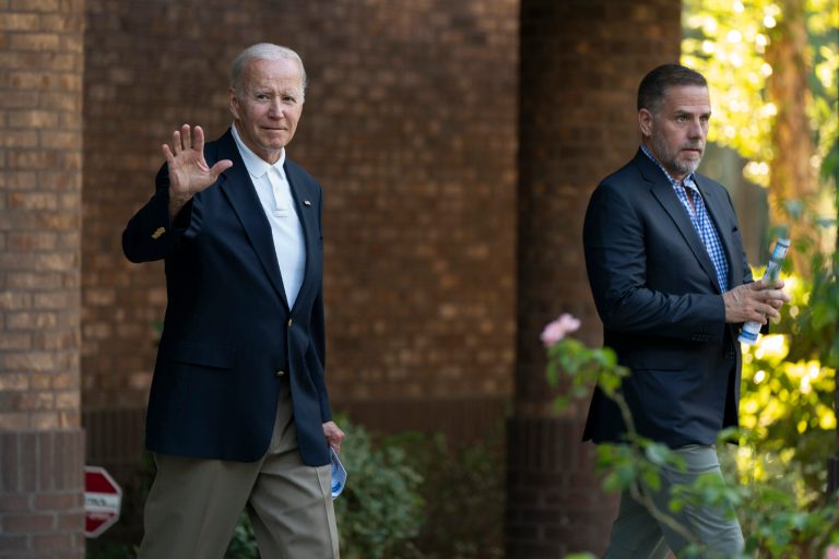 President Joe Biden with his son Hunter Biden waves as they leave Holy Spirit Catholic Church in Johns Island, South Carolina, after attending a Mass, Saturday, Aug. 13, 2022. 