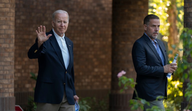 President Joe Biden waves as he leaves Holy Spirit Catholic Church in Johns Island, South Carolina, with his son Hunter Biden after attending a Mass on Saturday, Aug. 13, 2022.