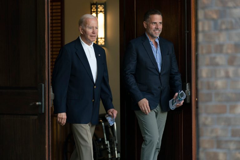 President Joe Biden and his son Hunter Biden leave Holy Spirit Catholic Church in Johns Island, S.C., after attending a Mass, Saturday, Aug. 13, 2022. Biden is in Kiawah Island with his family on vacation.