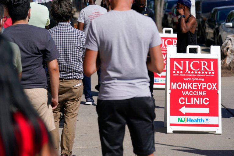 People line up to receive the monkeypox vaccine at a walk-in clinic at the North Jersey Community Research Initiative in Newark, N.J., Tuesday, Aug. 16, 2022. 