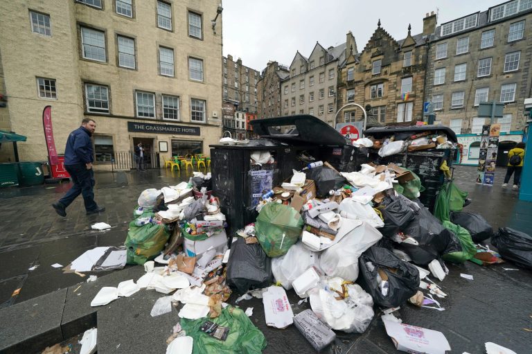 A view of overflowing bins in the Grassmarket area of Edinburgh where cleansing workers from the City of Edinburgh Council are on the fourth day of eleven of strike action in Scotland on Wednesday.