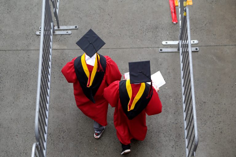 New graduates walk into the High Point Solutions Stadium before the start of the Rutgers University graduation ceremony in Piscataway Township, New Jersey.
