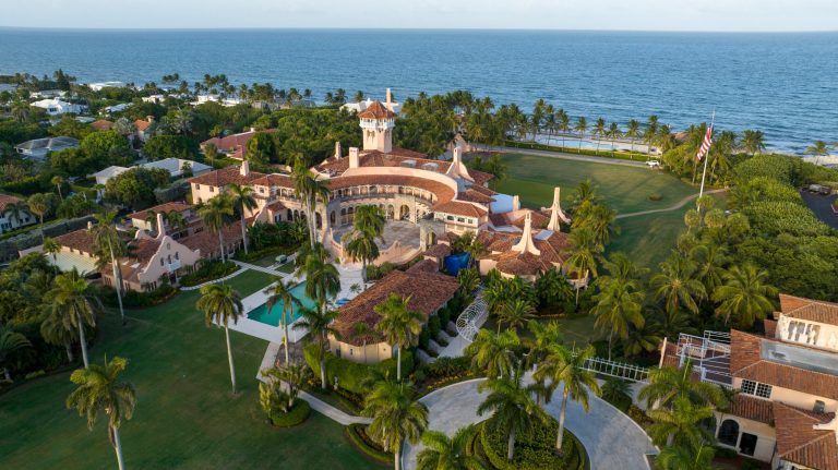 FILE - An aerial view of President Donald Trump's Mar-a-Lago estate Aug. 10, 2022, in Palm Beach, Fla. A judge on Aug. 25 ordered the Justice Department to make public a redacted version of the affidavit it relied on when federal agents searched the Florida estate of former President Donald Trump to look for classified documents. On Friday, Aug. 26, the website PACER.com experienced a crash due to a large amount of traffic from journalists trying to get the affidavit. (AP Photo/Steve Helber, File)