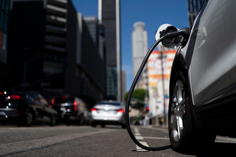 An electric vehicle is plugged into a charger in Los Angeles on Thursday.